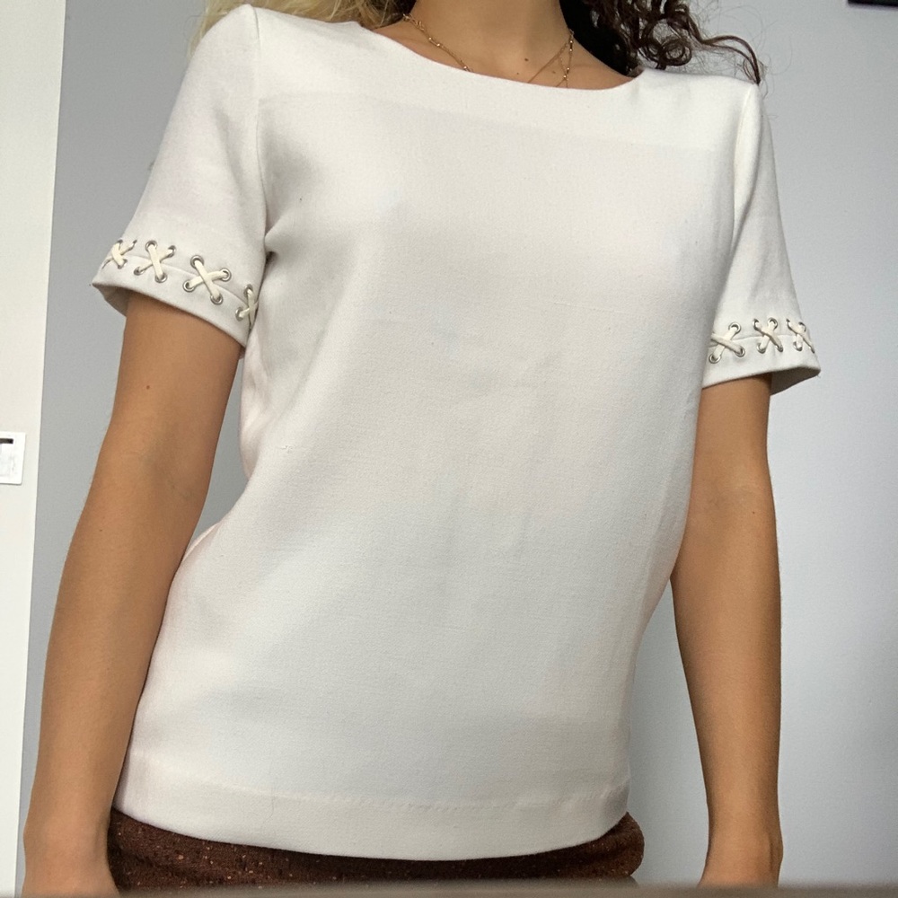 Contemporary White Blouse with Criss Cross details on sleeves